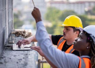 Engineering inspectors reviewing a construction site