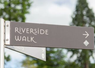 Wayfinding post sign for Riverside Walk