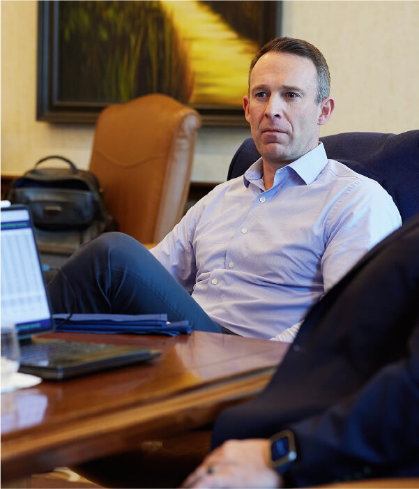 Tim Nelson listens to a board presentation