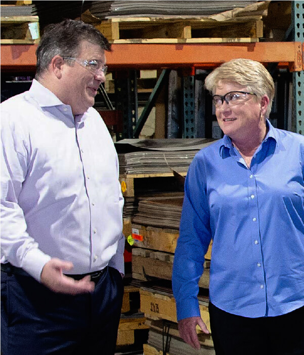 Scott Rivard of Saw Mill walks the warehouse with Allison Schultz, CEO of Southern Aluminum