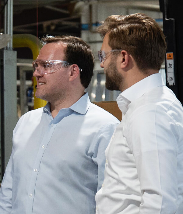 Scott VandeKerkhoff and Casey Yuhas of Saw Mill on a warehouse tour at Southern Aluminum